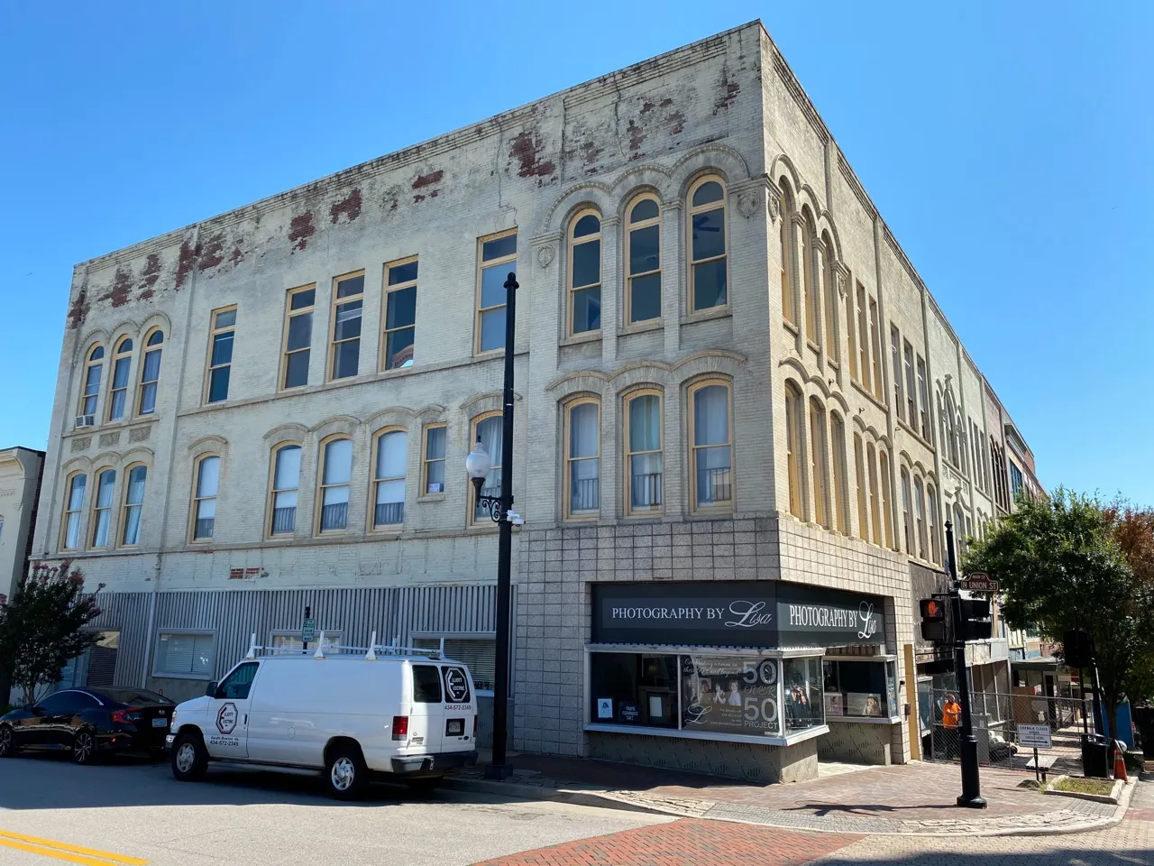 The 1904 livery stable and retail block in downtown Danville — a historic brick corner building with an open storefront.