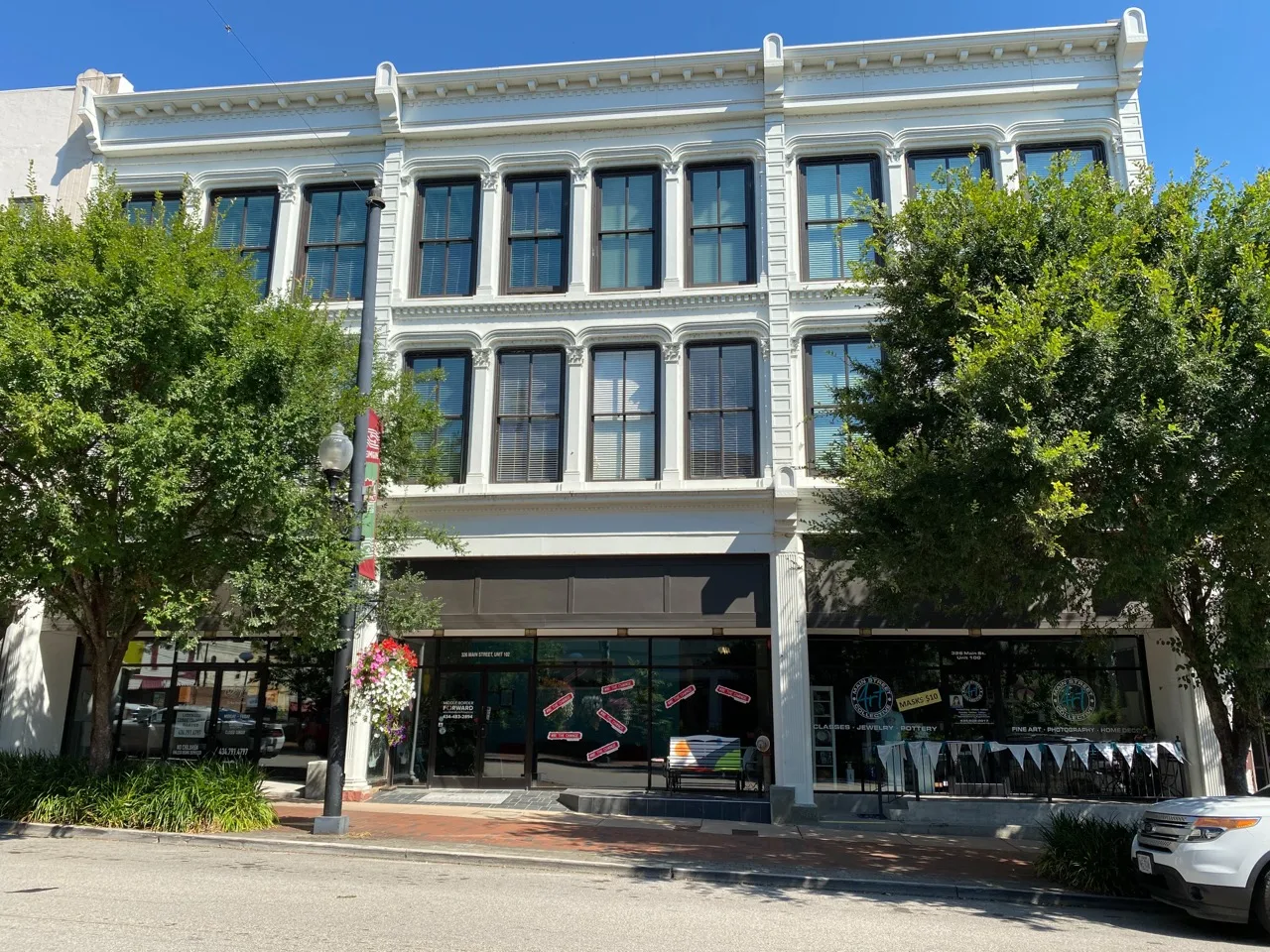The Pace Building in Danville — an ornate 1875 iron-fronted commercial building with an open business on the ground floor.