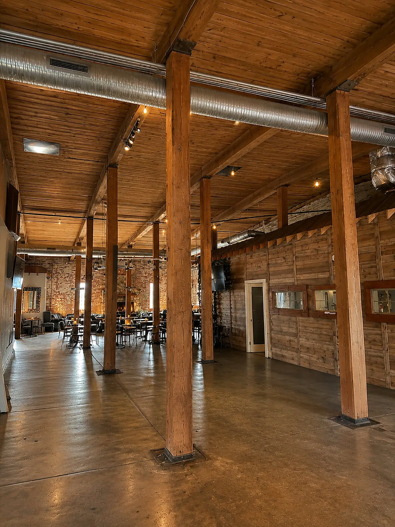 Open event hall with timber columns.