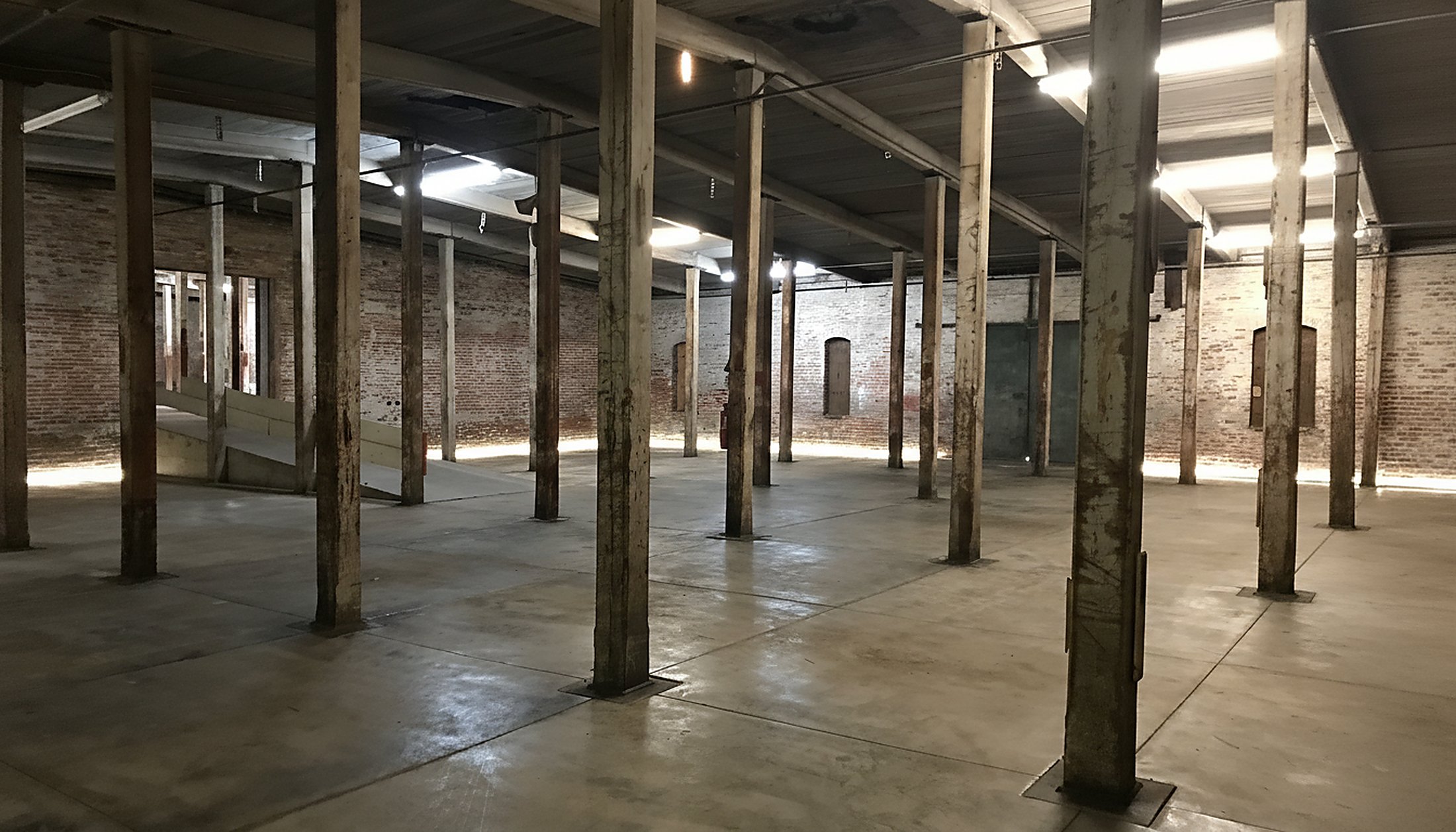 Raw warehouse interior — 7,000 SF blank canvas at 680 Lynn Street